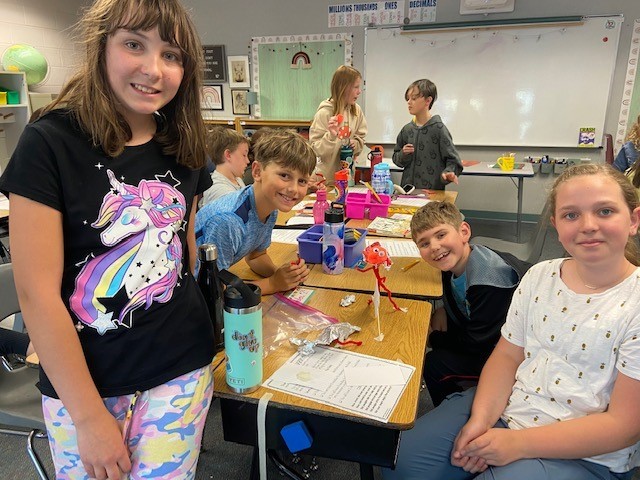 5th grade ATES students work on a project during class.